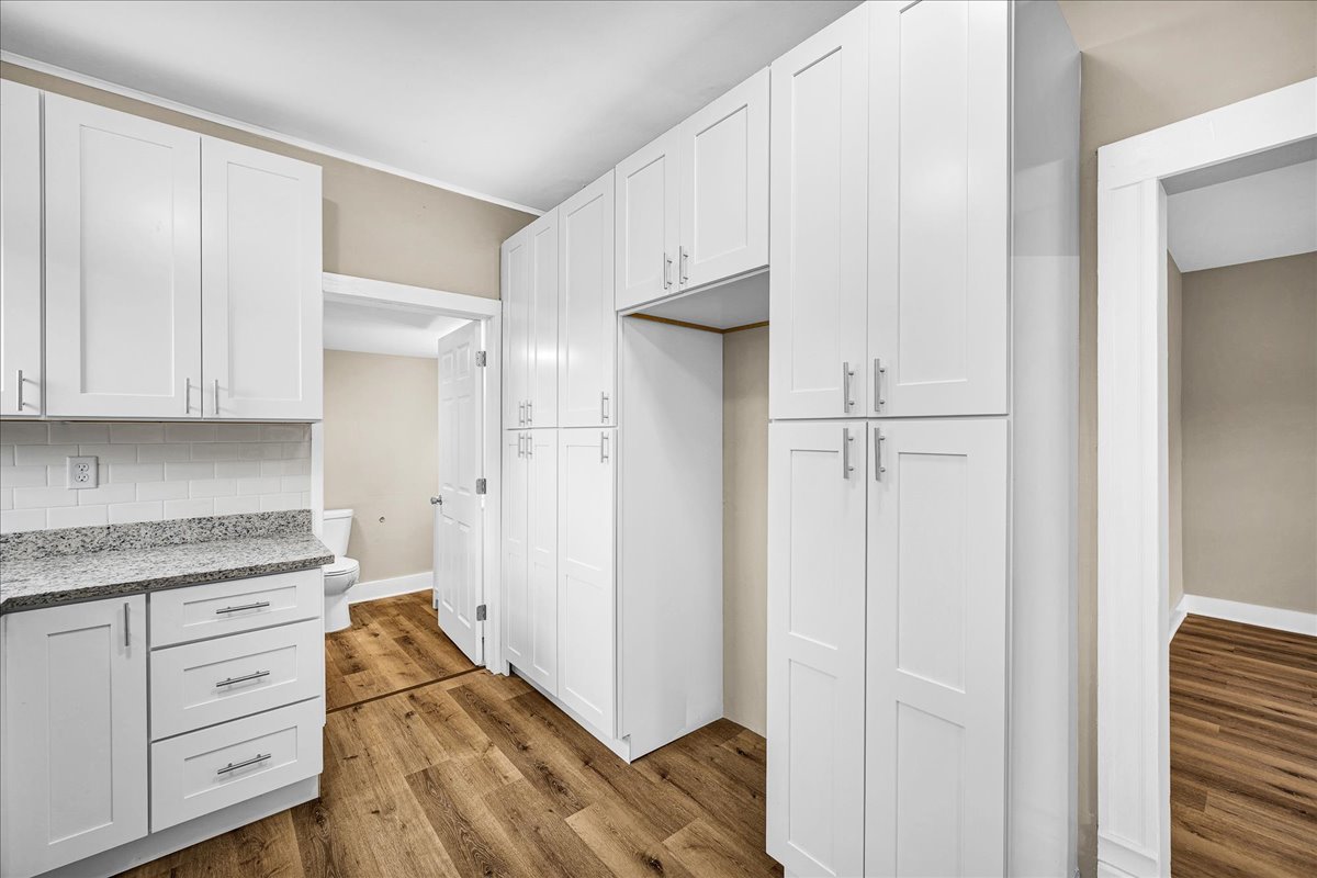 222 West Chestnut Street Hoopeston, IL 60942 - Photo 8 of 28 a kitchen with white cabinets and white appliances