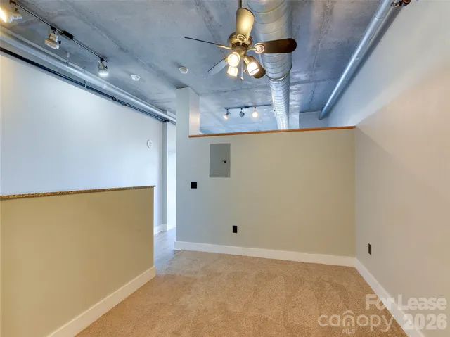 a view of a hallway with a chandelier
