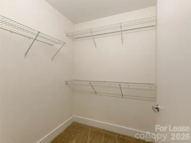 a view of a room with racks on the wall