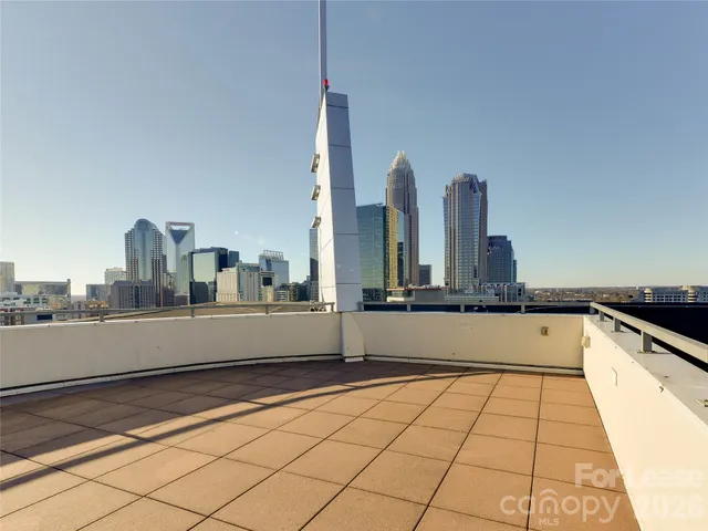 a view of a kitchen with kitchen island and a sink