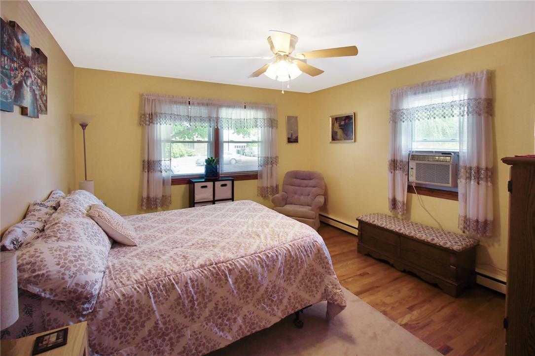 1256 Ridge Avenue Whitehall, PA 18052 - Photo 24 of 43 Well-lit bedroom with warm wooden flooring and abundant natural light.