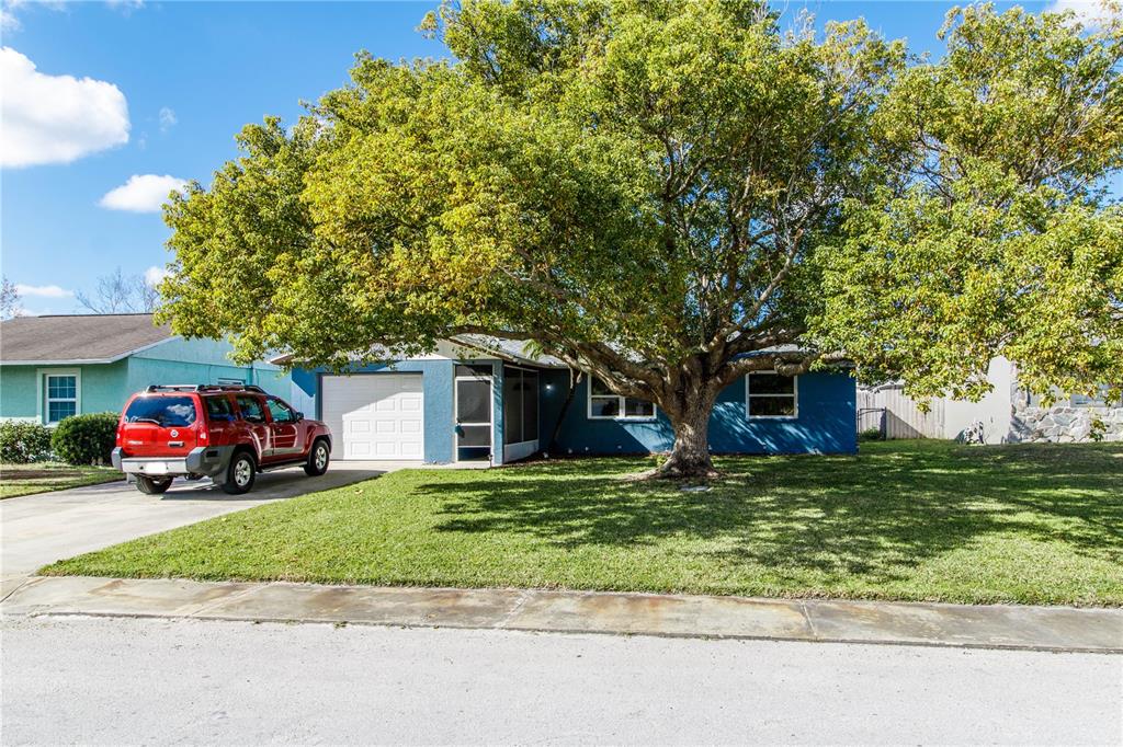 a view of a car in front of a house