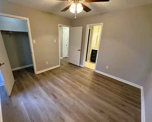 a bedroom with a bed and furniture