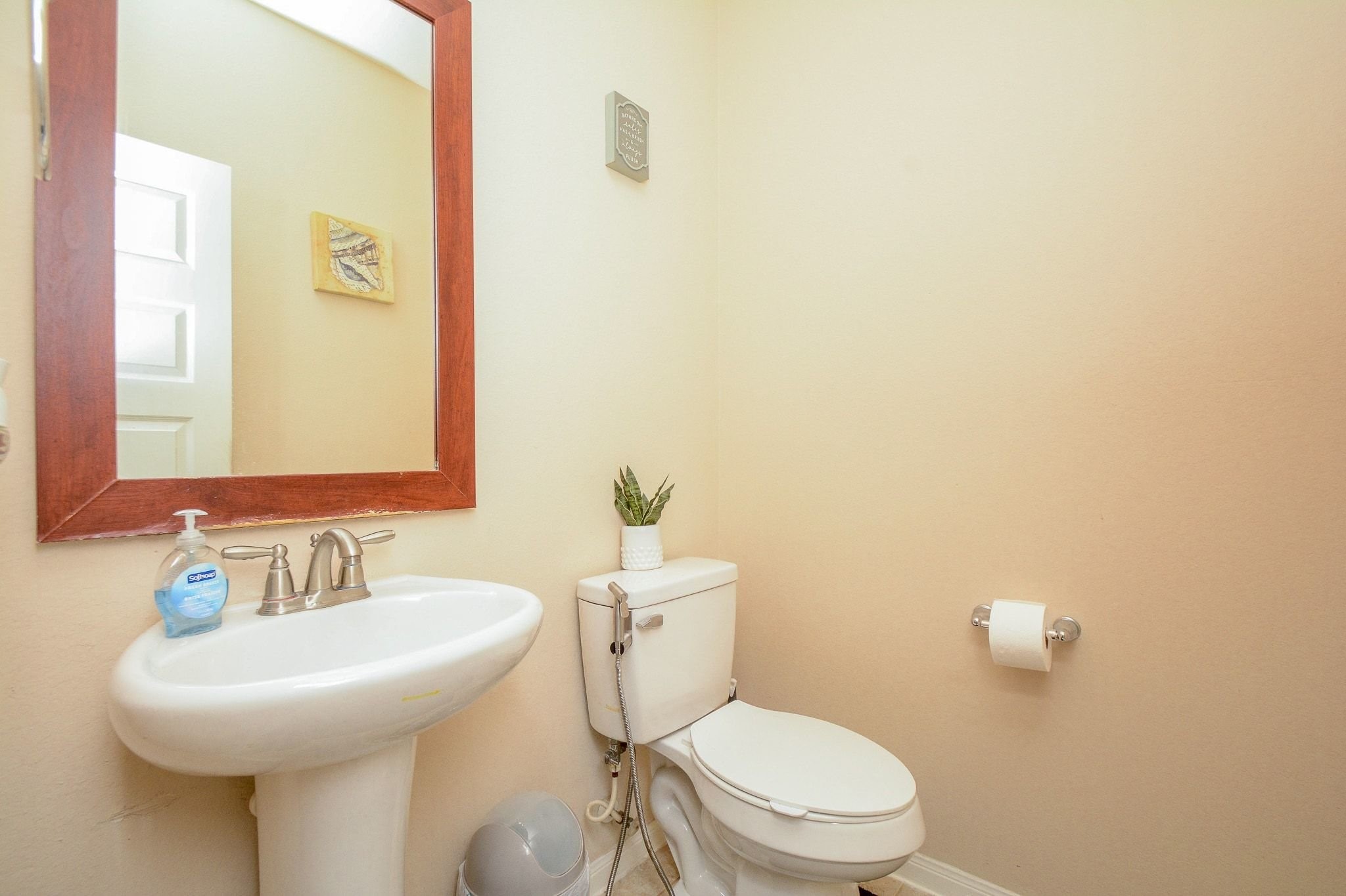 7046 Sliding Rock Circle Spring, TX 77379 - Photo 29 of 41 Cozy guest restroom with a modern sink and elegant mirror, perfect for visitors.