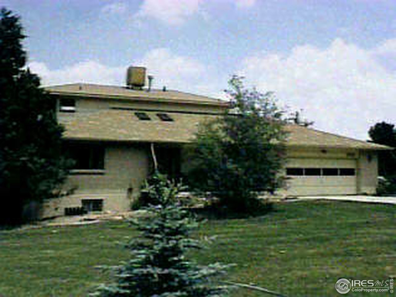 8515 Baseline Road Lafayette, CO 80026 - Photo 1 of 1 a front view of a house with a yard