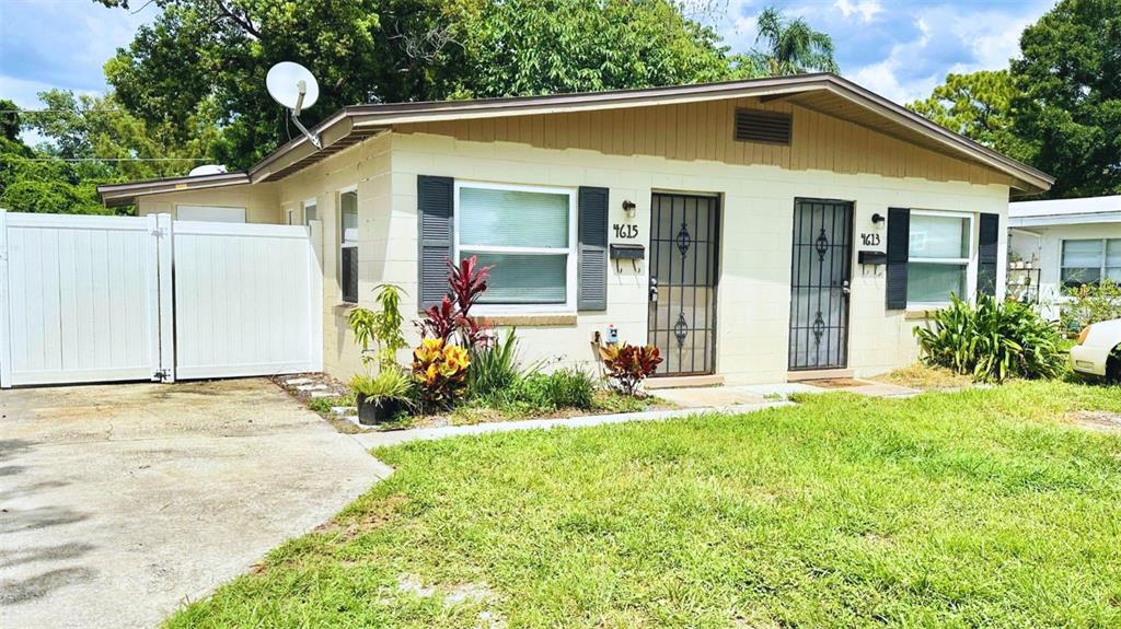 a front view of a house with a yard and porch