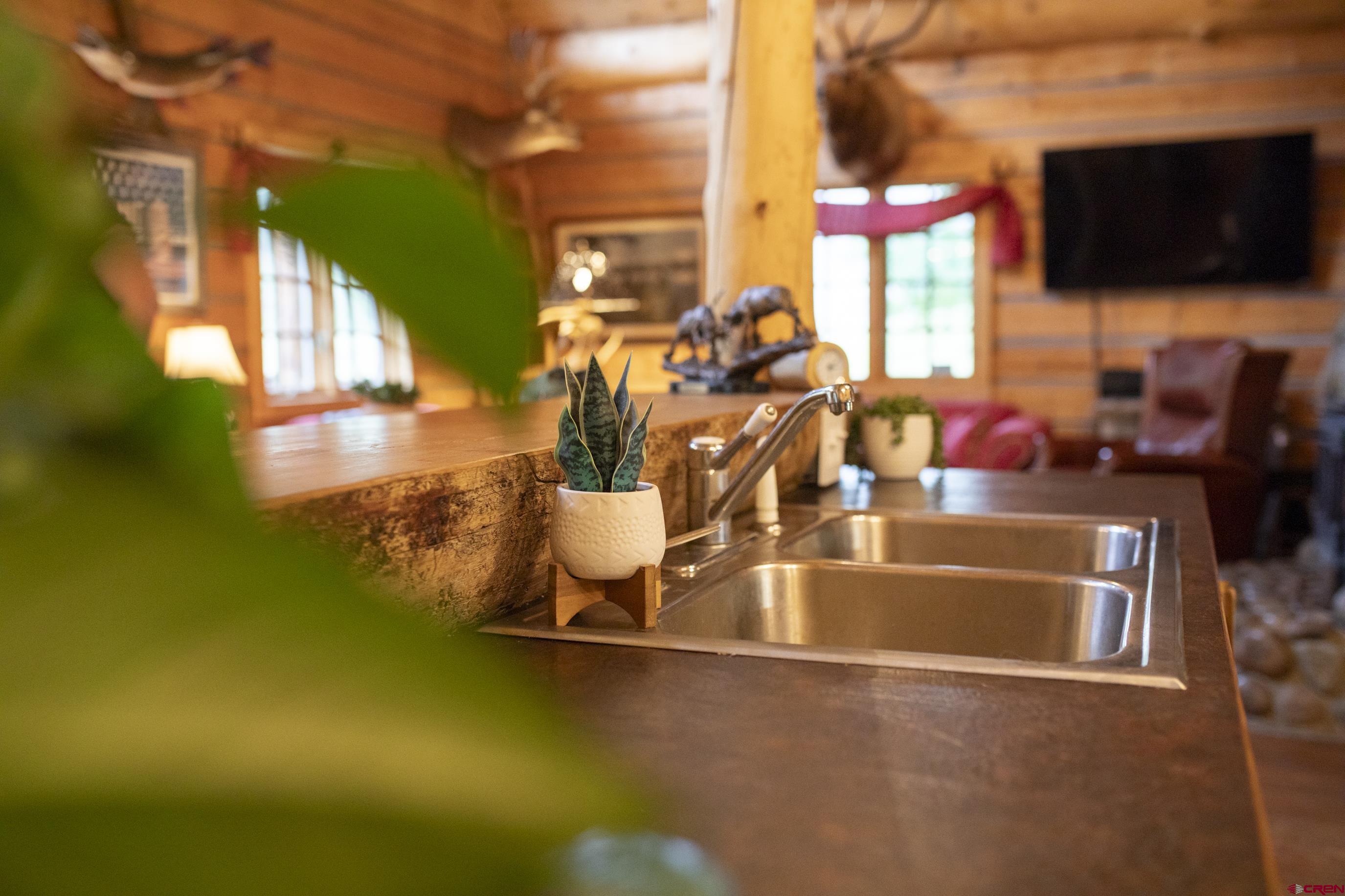2150 Usfs 521 Road, Unit 18A Creede, CO 81130 - Photo 21 of 31 a view of a swimming pool with a yard and sitting area