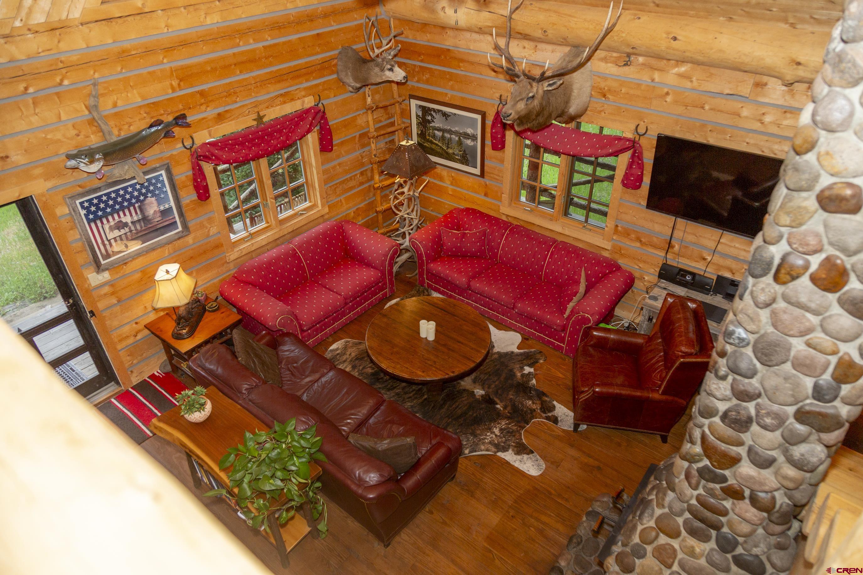 2150 Usfs 521 Road, Unit 18A Creede, CO 81130 - Photo 5 of 31 a view of a chairs and table in a backyard