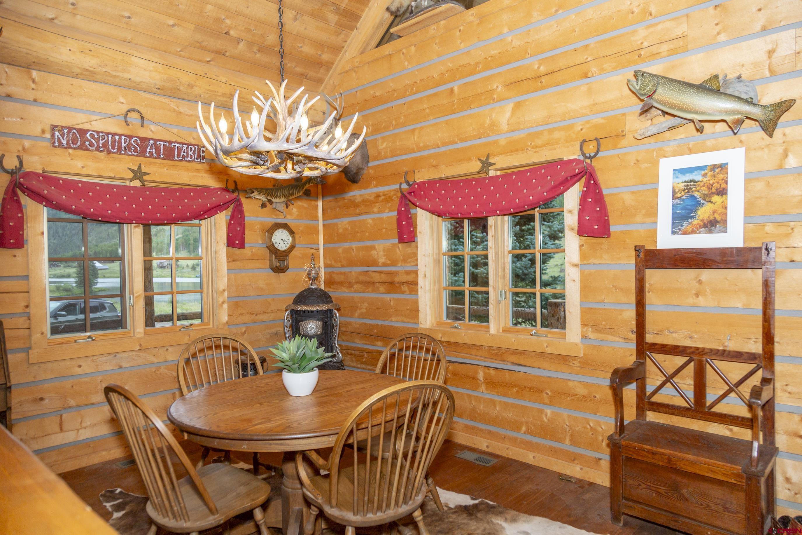 2150 Usfs 521 Road, Unit 18A Creede, CO 81130 - Photo 8 of 31 a view of a cafe with a table and chairs