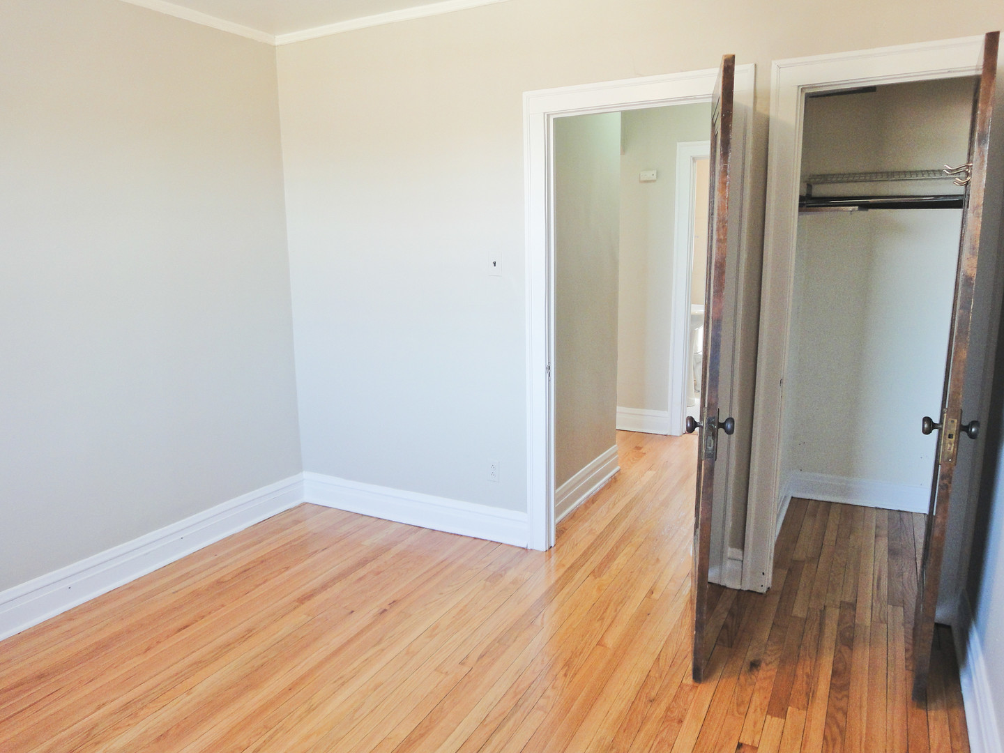 1941 Grove Avenue, Unit 201 Berwyn, IL 60402 - Photo 12 of 13 a view of a hallway with wooden floor and a bathroom