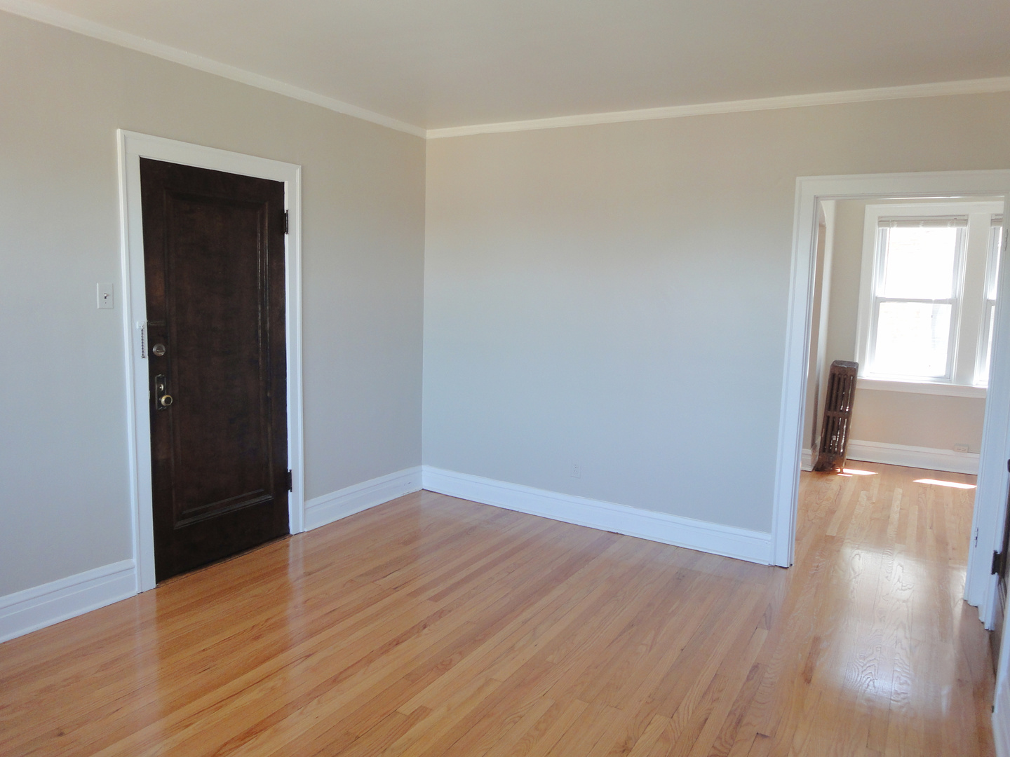 1941 Grove Avenue, Unit 201 Berwyn, IL 60402 - Photo 5 of 13 wooden floor in an empty room with a window