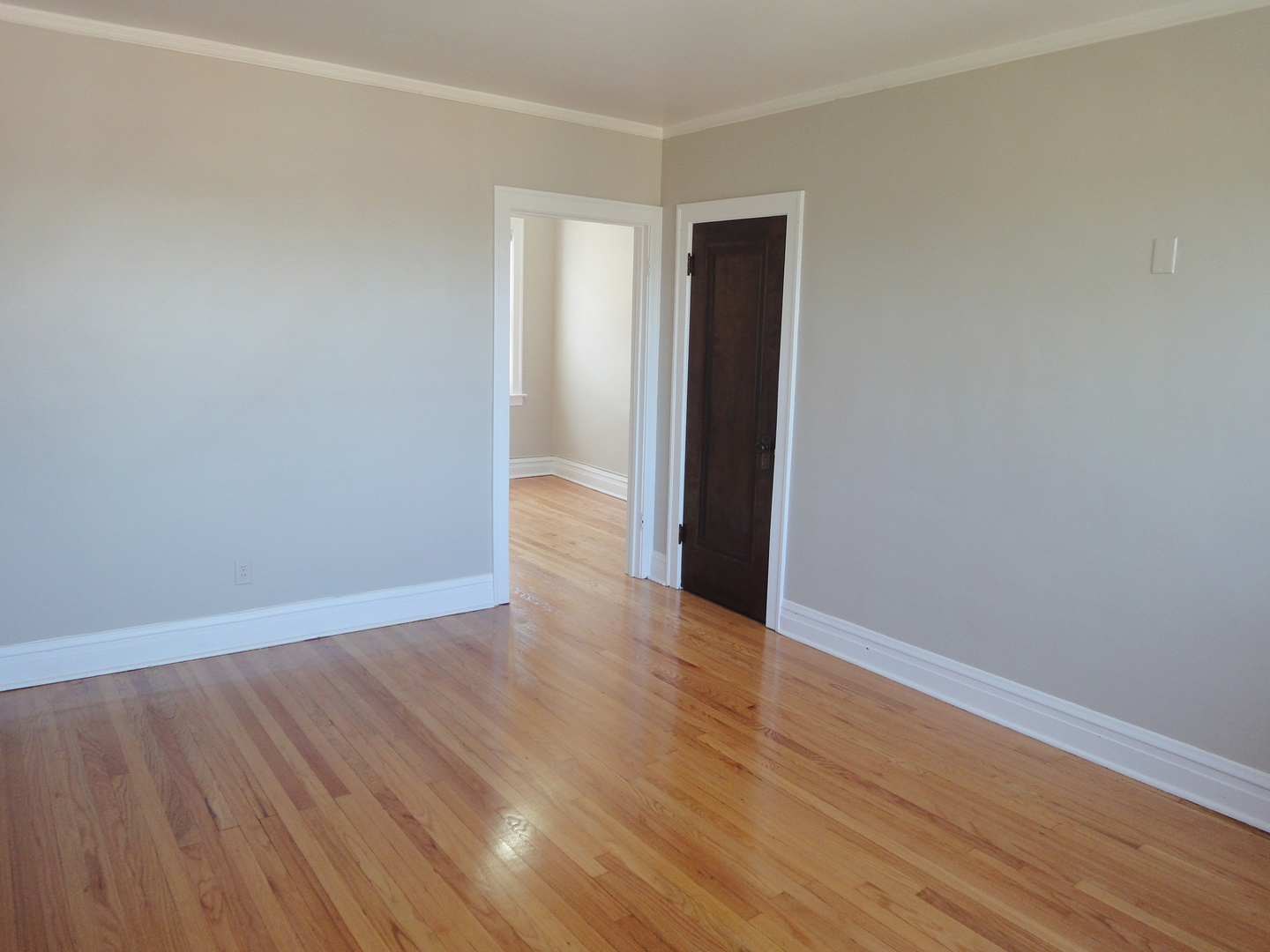 1941 Grove Avenue, Unit 201 Berwyn, IL 60402 - Photo 6 of 13 a view of an empty room with wooden floor