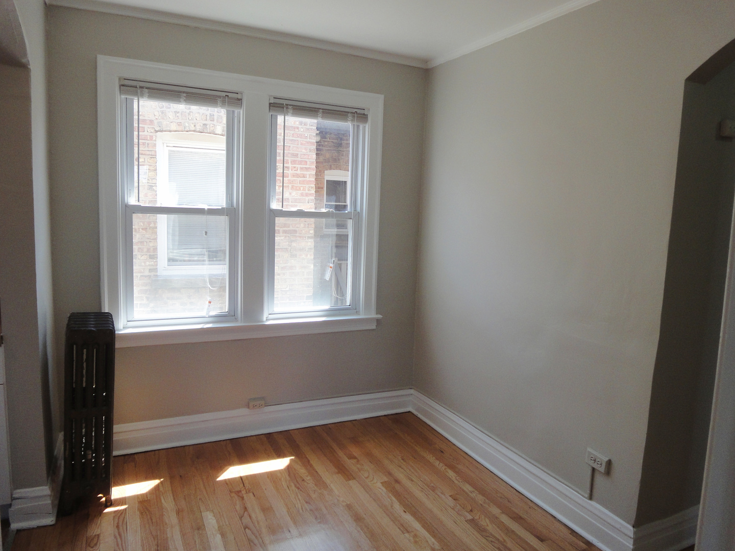 1941 Grove Avenue, Unit 201 Berwyn, IL 60402 - Photo 7 of 13 a view of a room with wooden floor and a window