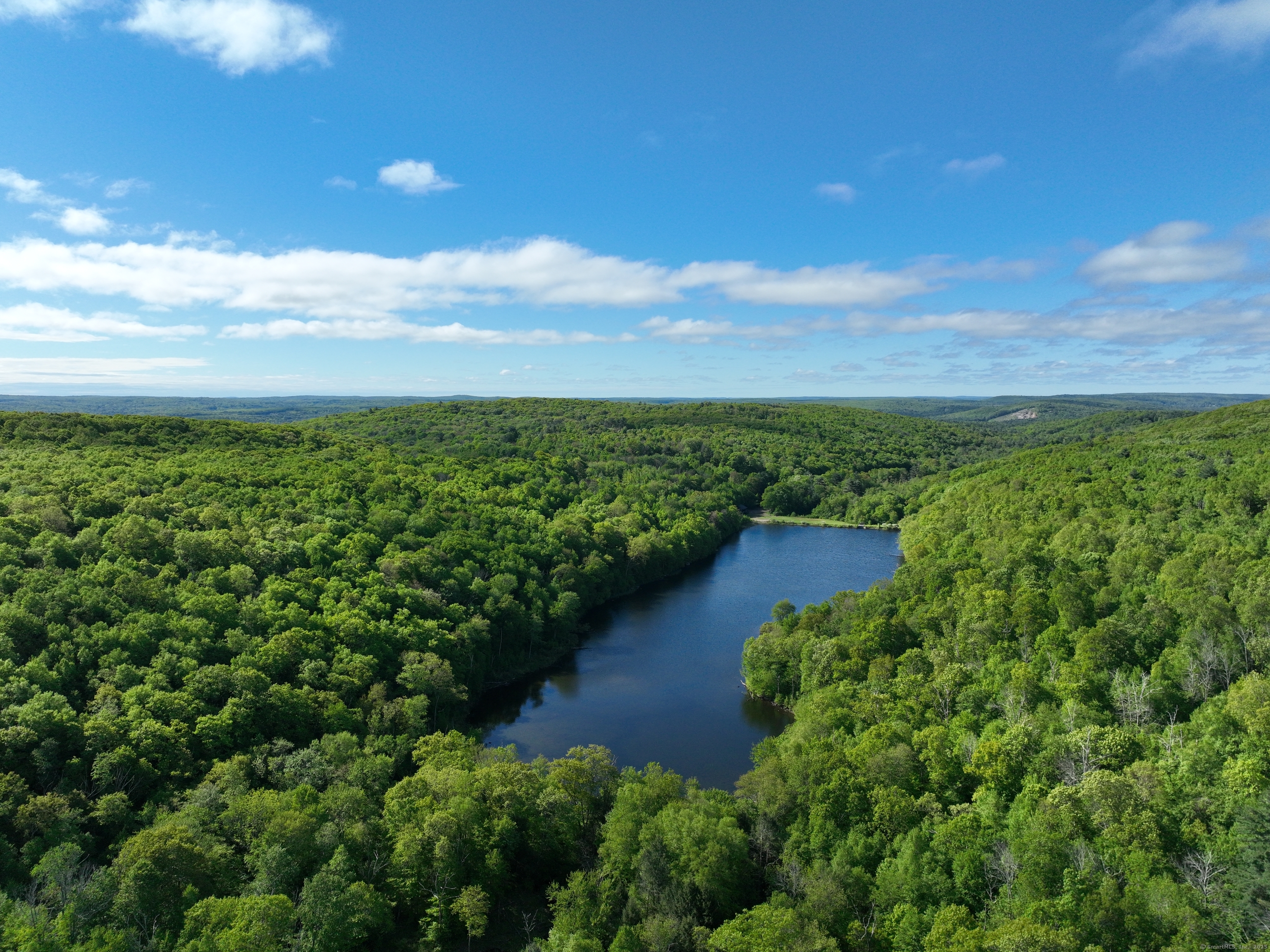 201 Diamond Ledge Road Stafford, CT 06076 - Photo 15 of 25 an aerial view of a houses with outdoor space and trees all around