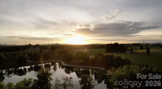 a view of a lake in middle of forest