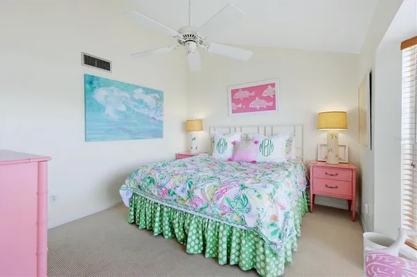 a bedroom with a bed and a table