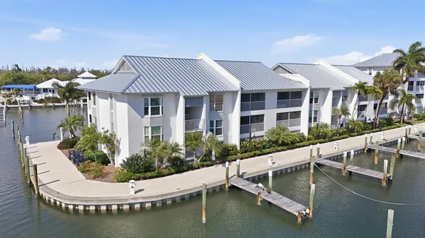 a view of swimming pool with outdoor seating and plants