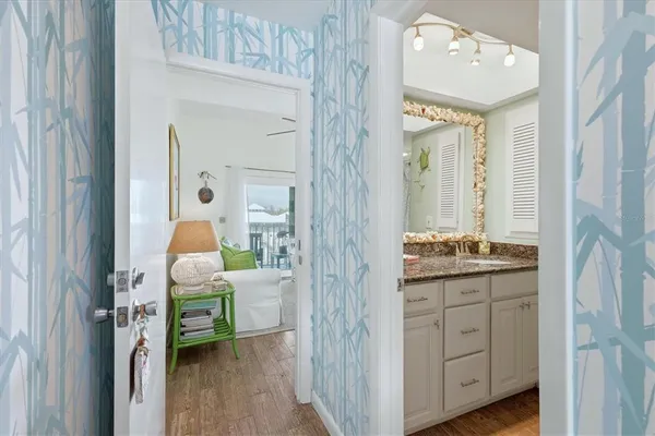 a en suite bathroom with a sink a mirror and a shower