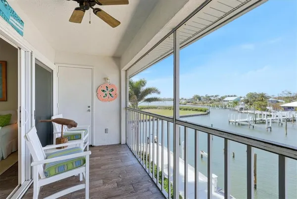 a view of balcony with furniture