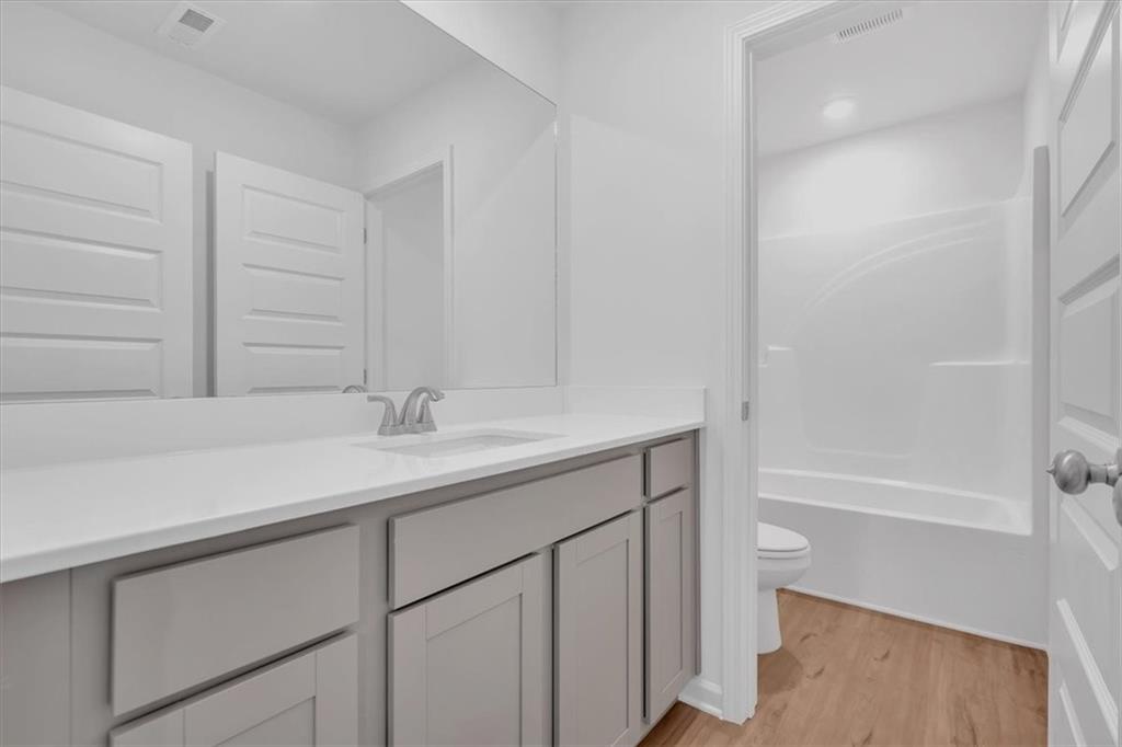 103 Lavender Circle Calhoun, GA 30701 - Photo 10 of 19 a bathroom with a sink and a mirror