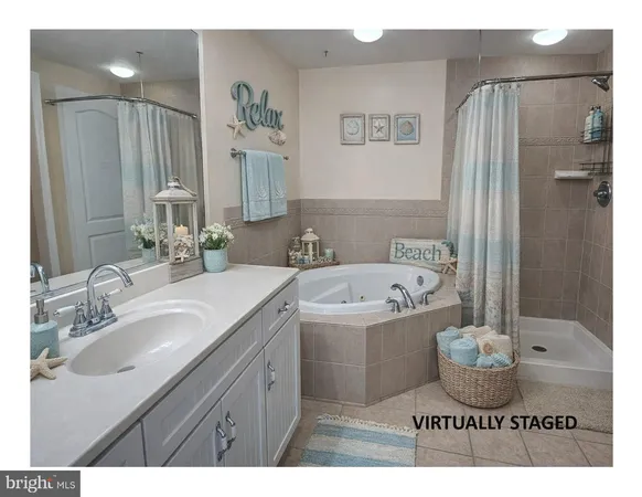 a bathroom with a granite countertop sink a toilet a mirror and shower