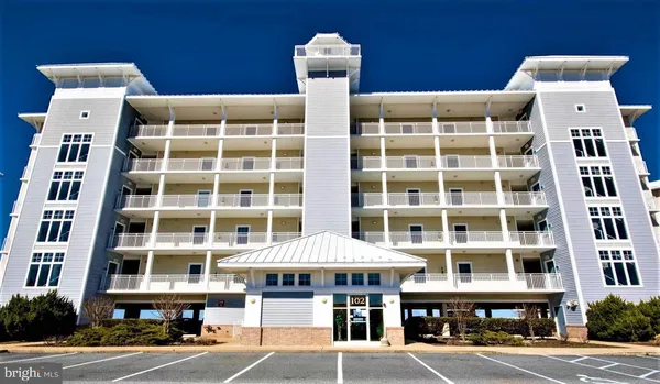 a front view of a building with a parking space