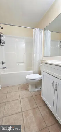 a bathroom with a sink a toilet and a bathtub