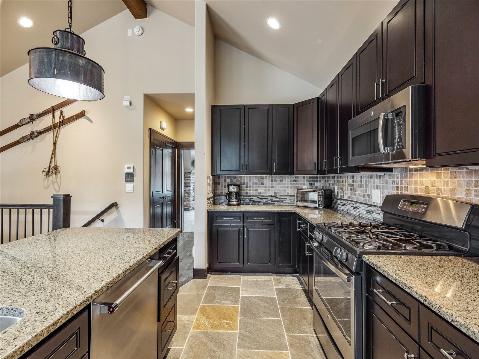 68 Independence Lane Keystone, CO 80435 - Photo 7 of 43 a kitchen with a stove a sink and a microwave