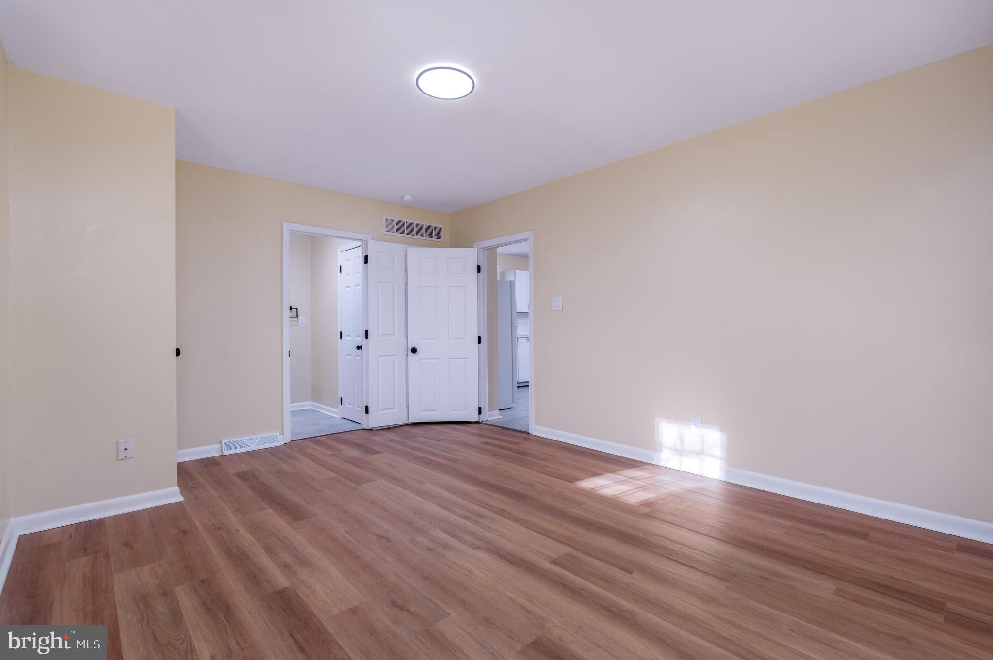 344 Nimitz Road Dover, DE 19901 - Photo 12 of 26 a view of an empty room with wooden floor