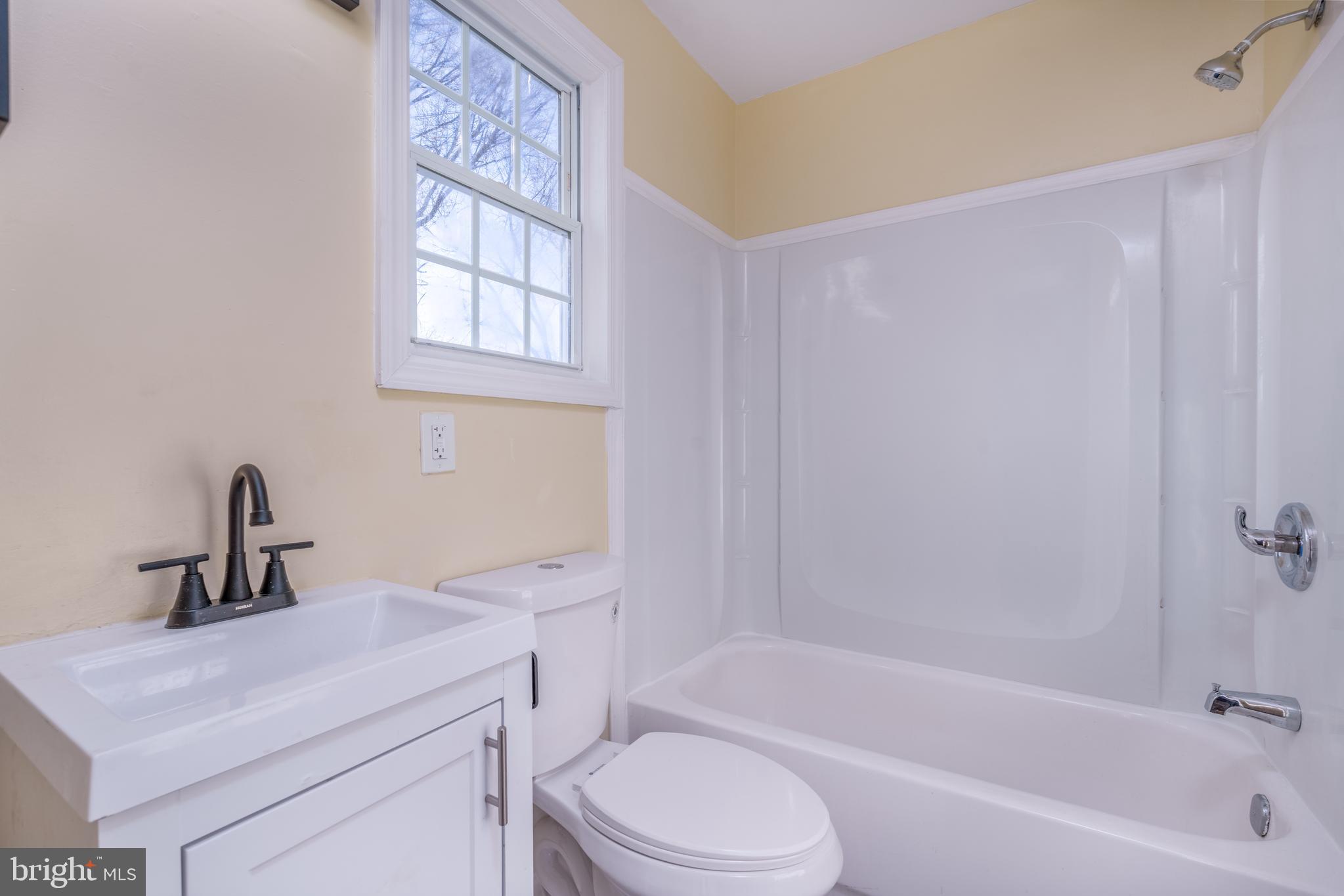 344 Nimitz Road Dover, DE 19901 - Photo 13 of 26 a bathroom with a sink a toilet and bathtub