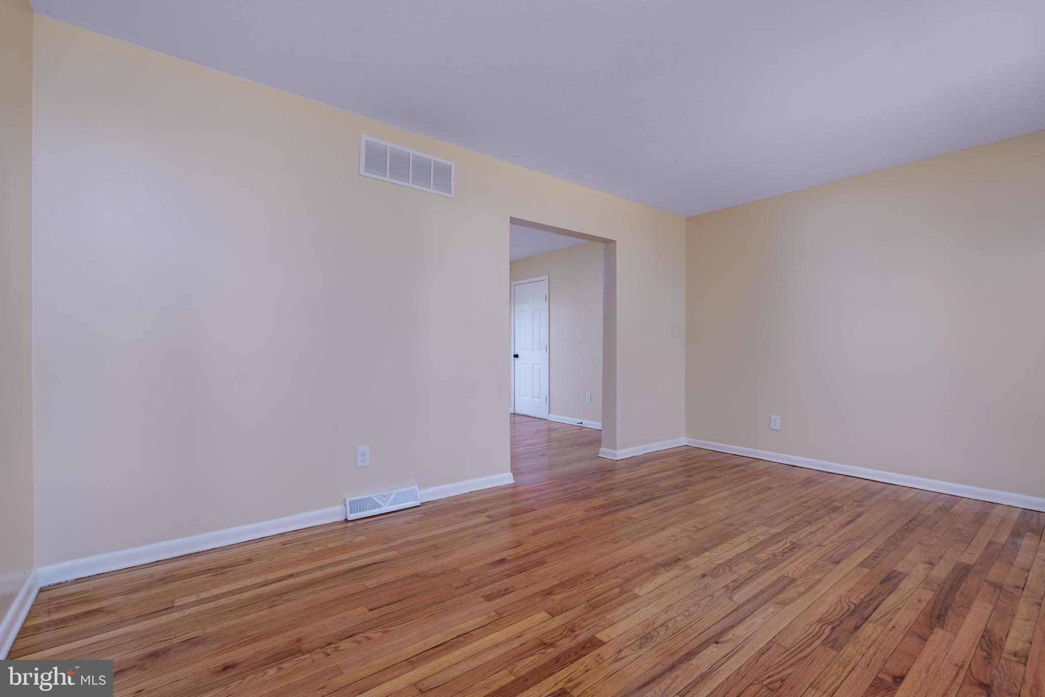 344 Nimitz Road Dover, DE 19901 - Photo 21 of 26 a view of an empty room with wooden floor