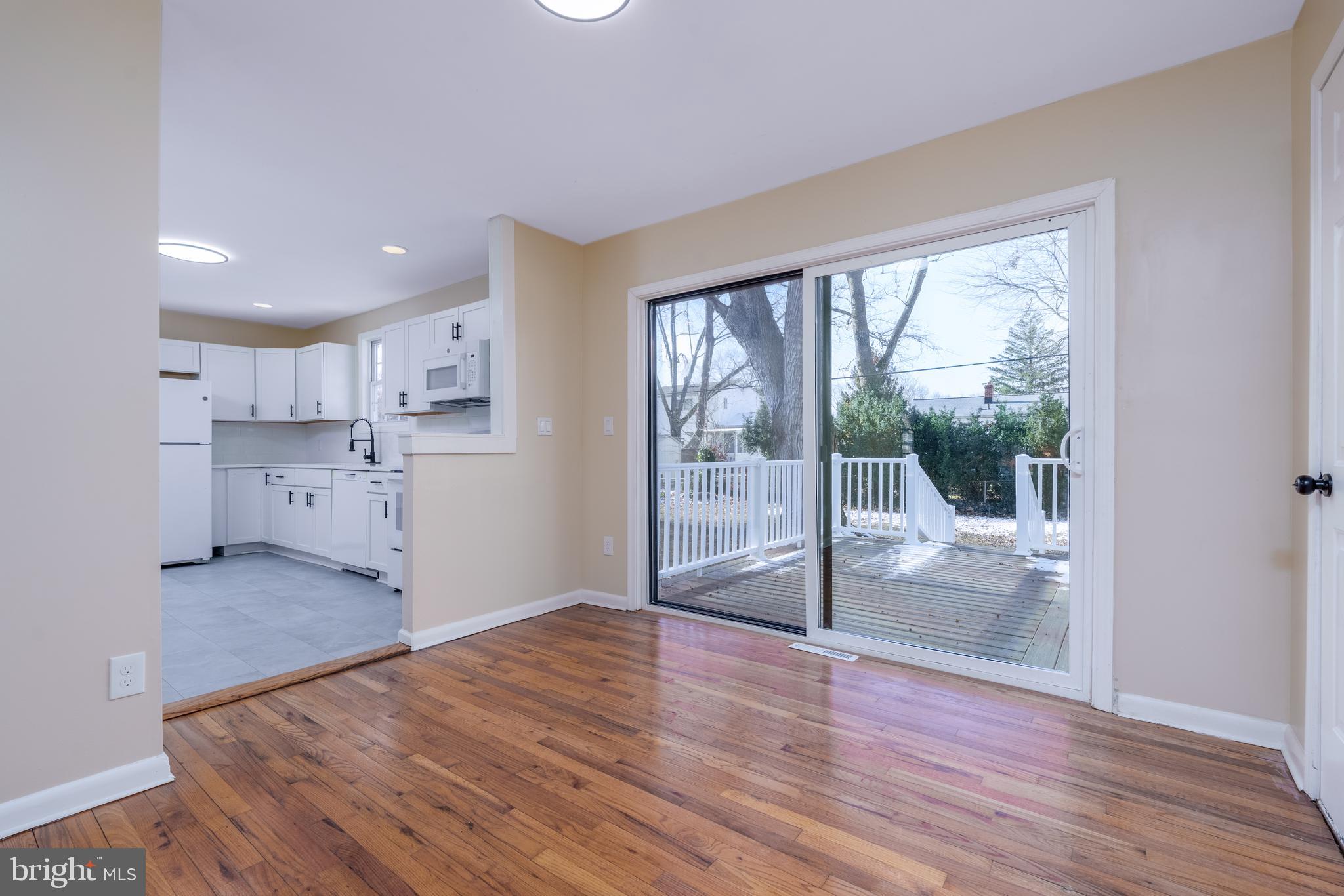 344 Nimitz Road Dover, DE 19901 - Photo 7 of 26 a view of a kitchen with wooden floor and a window