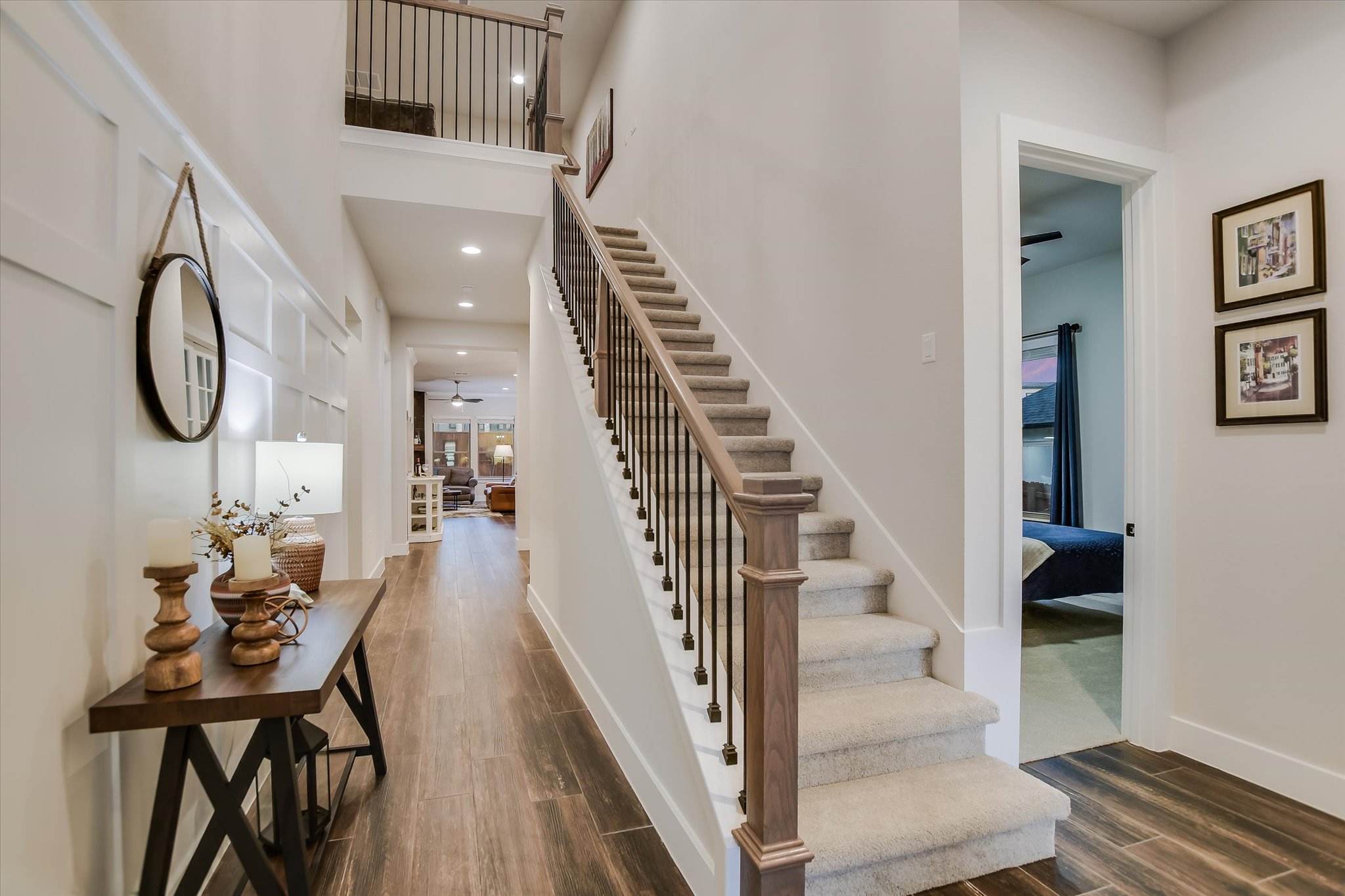332 Axis Loop Georgetown, TX 78628 - Photo 4 of 37 Foyer entrance featuring baseboards, stairs, recessed lighting, a towering ceiling, and wood flooring