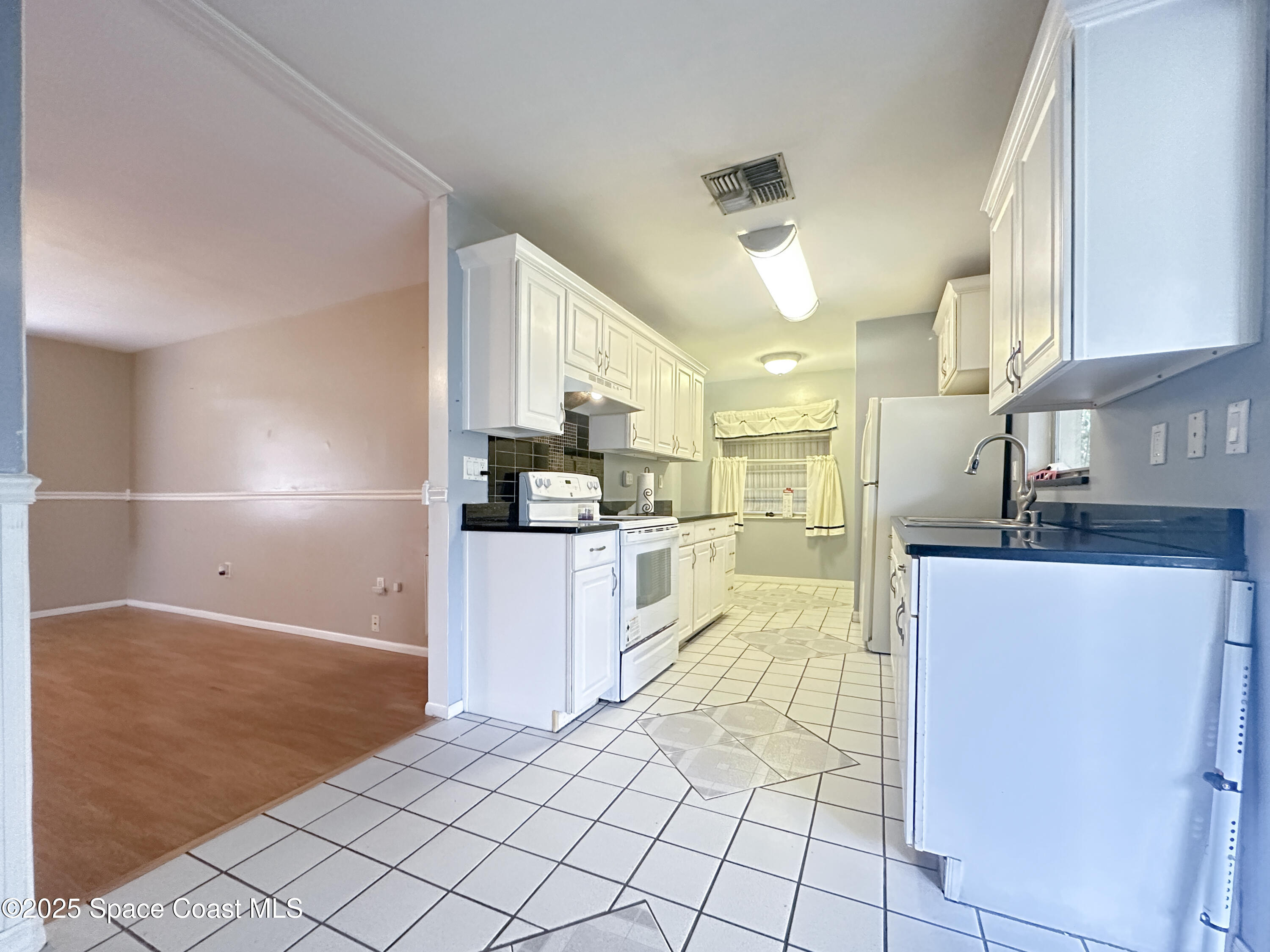 8215 Autumn Oak Avenue Port Richey, FL 34668 - Photo 11 of 21 a large kitchen with cabinets