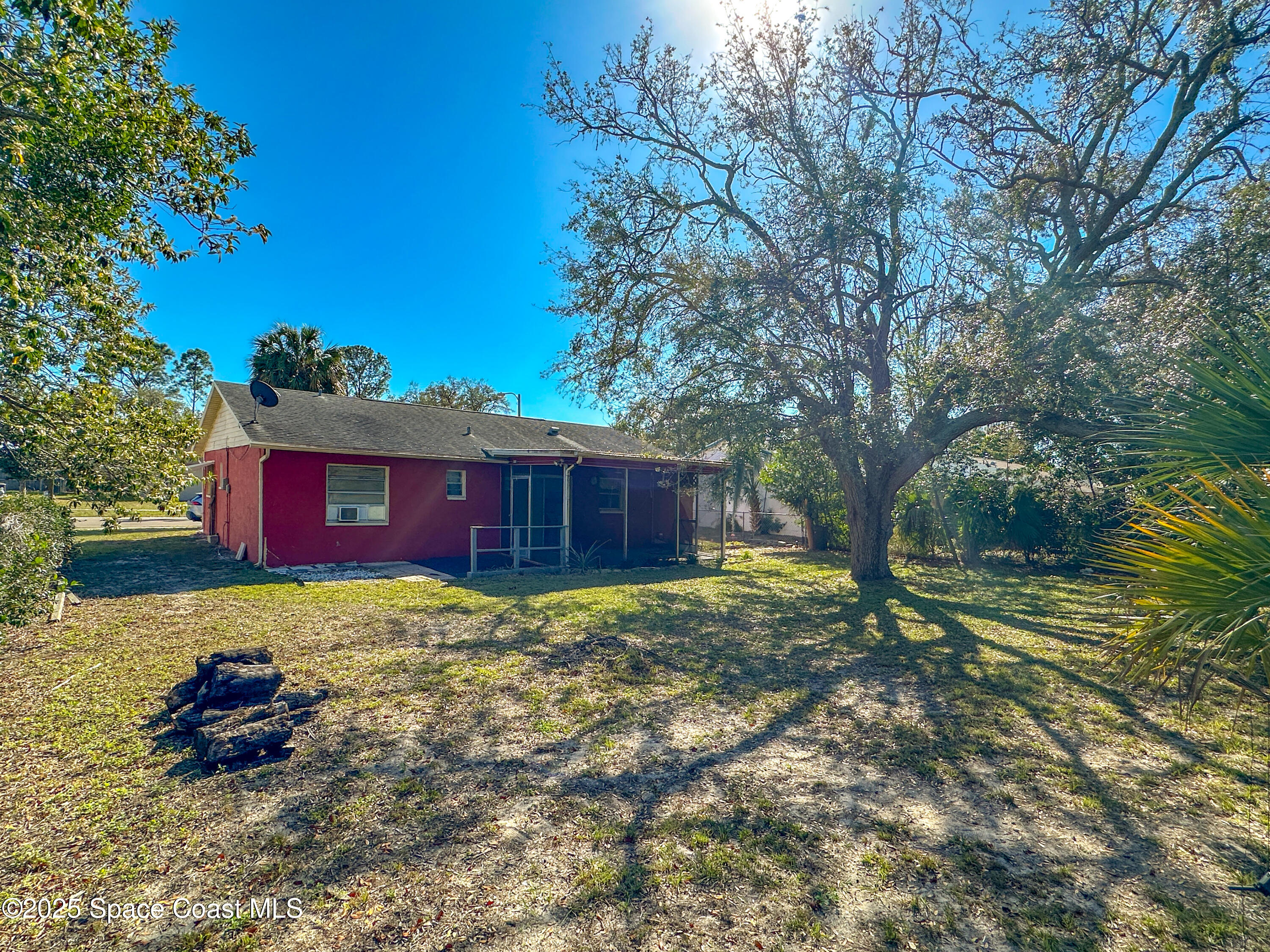 8215 Autumn Oak Avenue Port Richey, FL 34668 - Photo 7 of 21 a yard with lots of trees