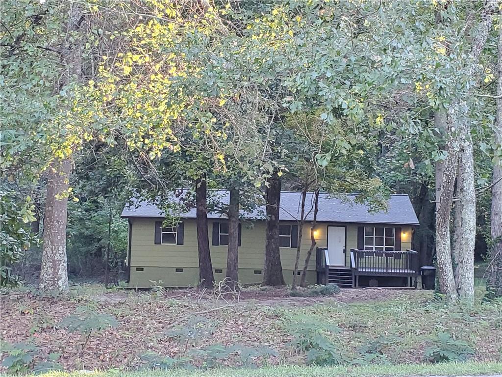 8460 Cedar Grove Road Fairburn, GA 30213 - Photo 1 of 1 a front view of a house with garden