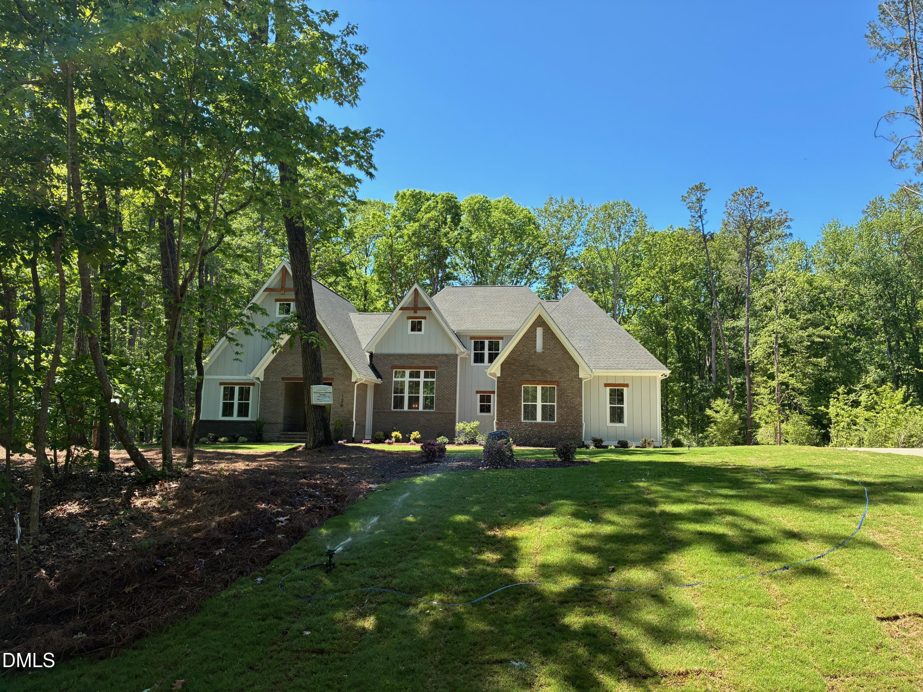638 Old Goldston Road Pittsboro, NC 27312 - Photo 11 of 28 a front view of a house with a garden