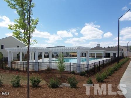 8323 Pilots View Drive Raleigh, NC 27617 - Photo 5 of 5 a front view of a house with a garden and plants