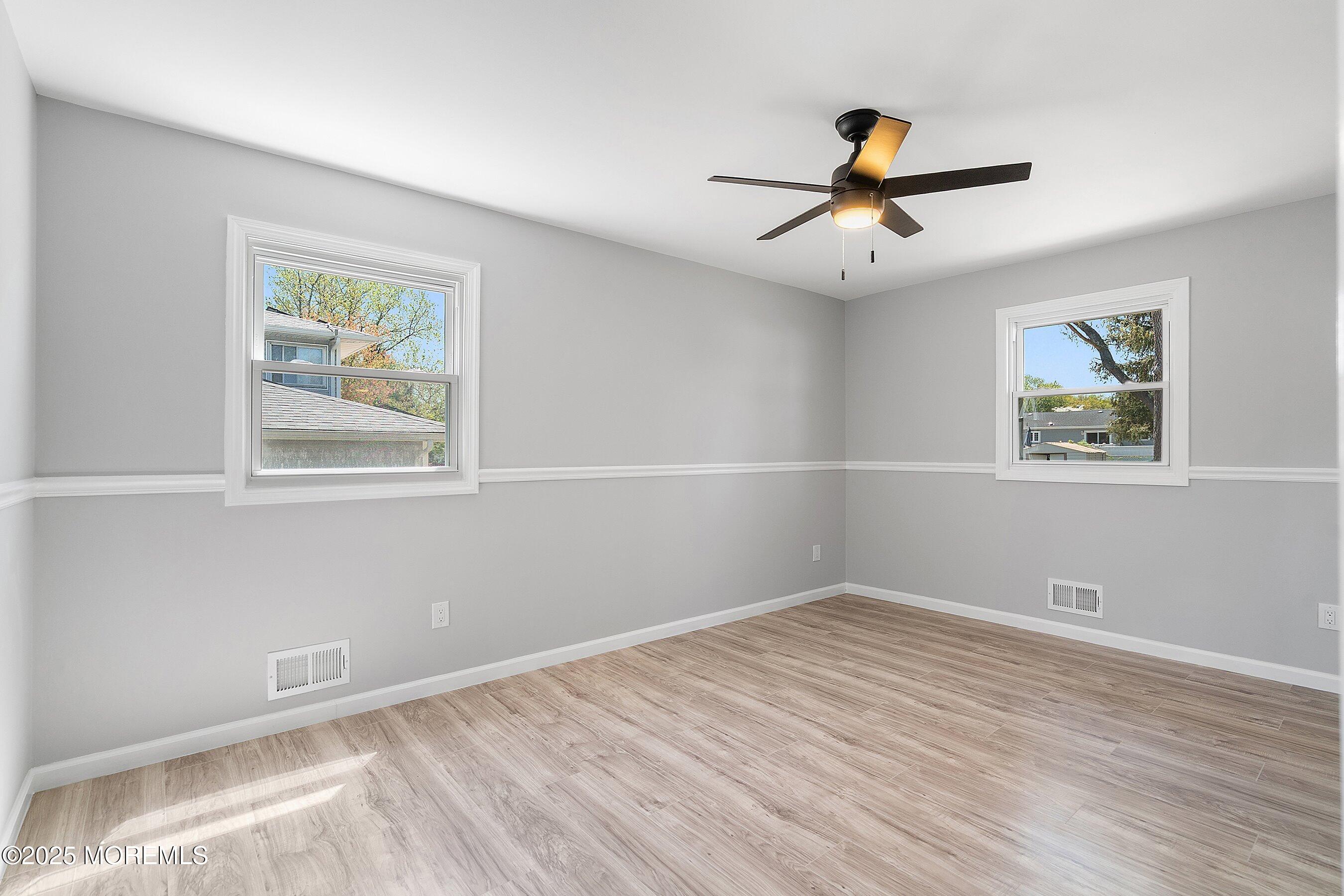 15 Springhill Drive Howell, NJ 07731 - Photo 16 of 32 a view of room with window and ceiling fan