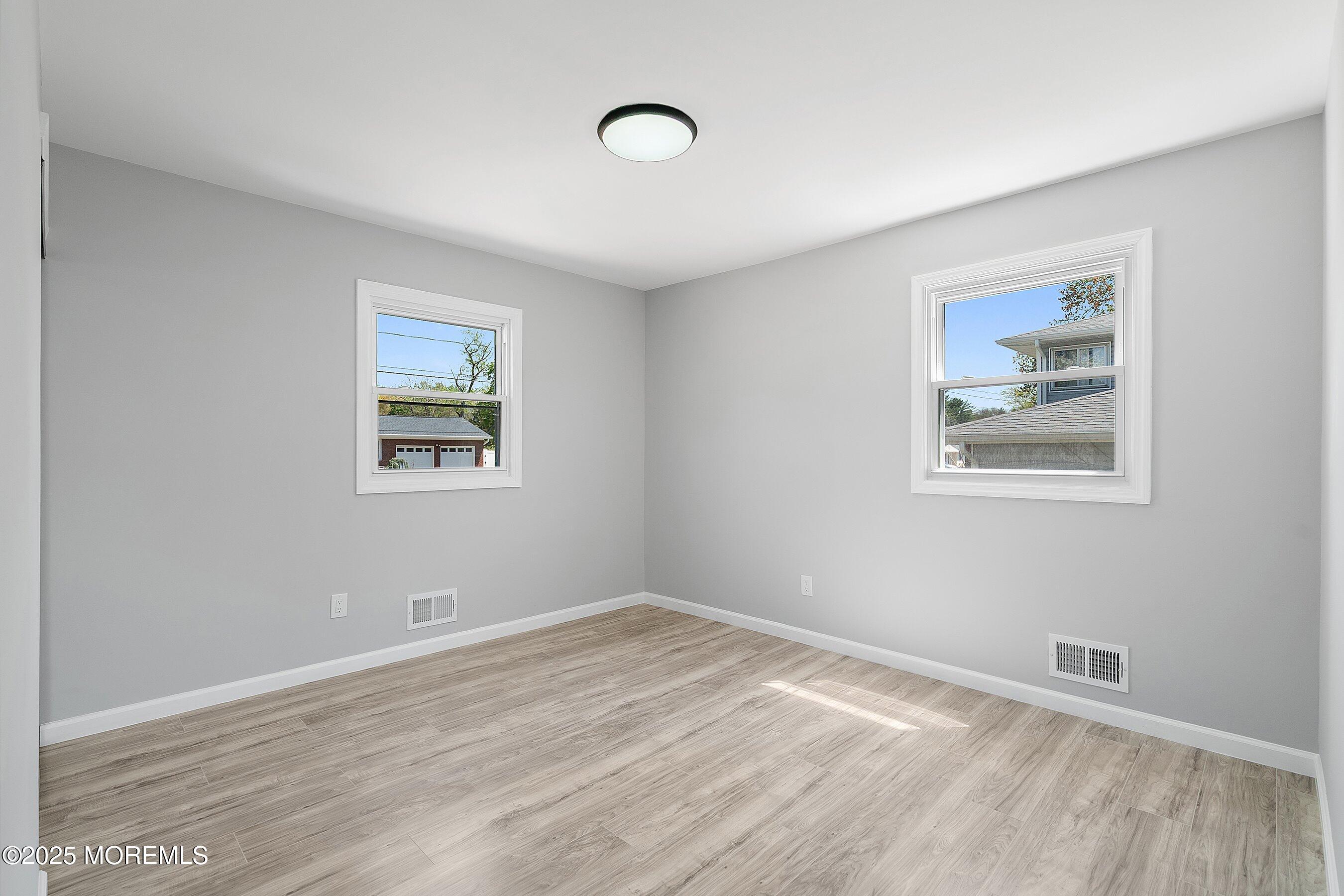 15 Springhill Drive Howell, NJ 07731 - Photo 20 of 32 a view of empty room with wooden floor