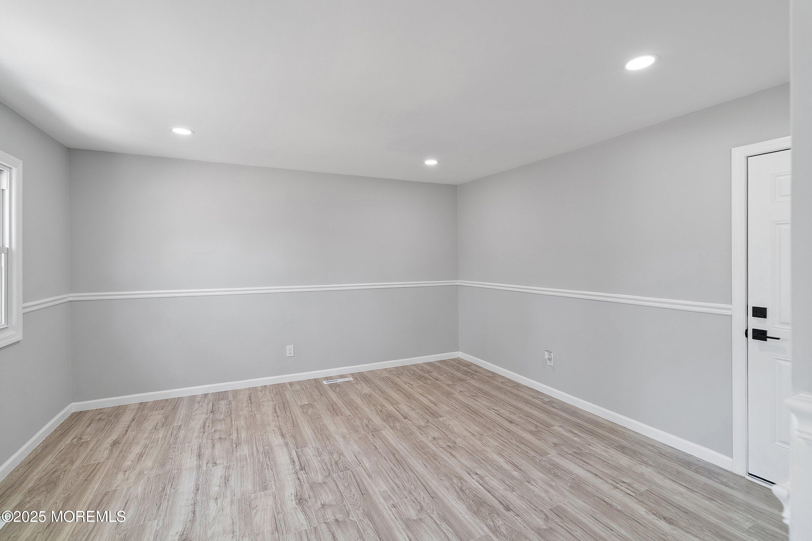 15 Springhill Drive Howell, NJ 07731 - Photo 22 of 32 a view of room with window and wooden floor