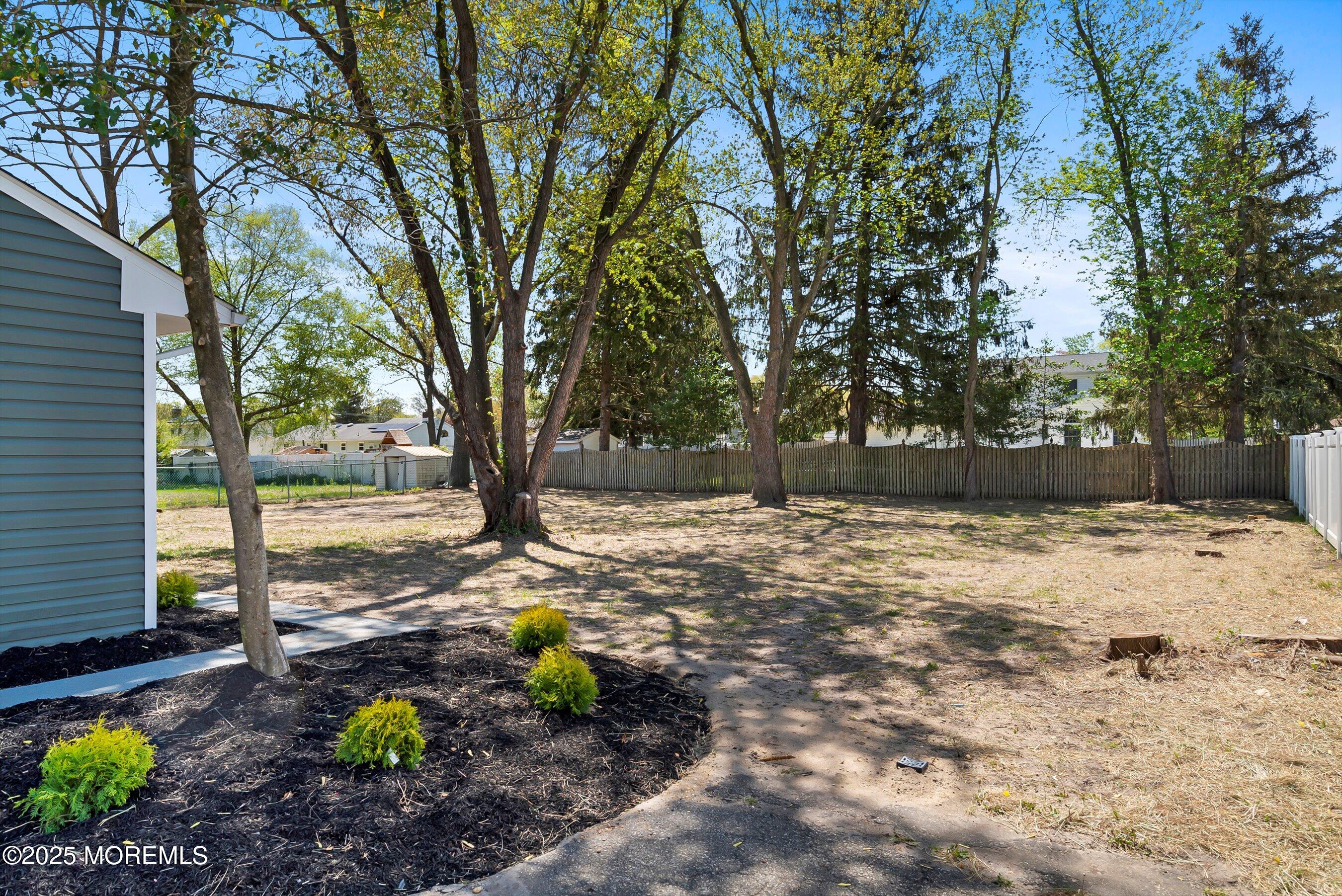 15 Springhill Drive Howell, NJ 07731 - Photo 30 of 32 a view of a backyard with large trees