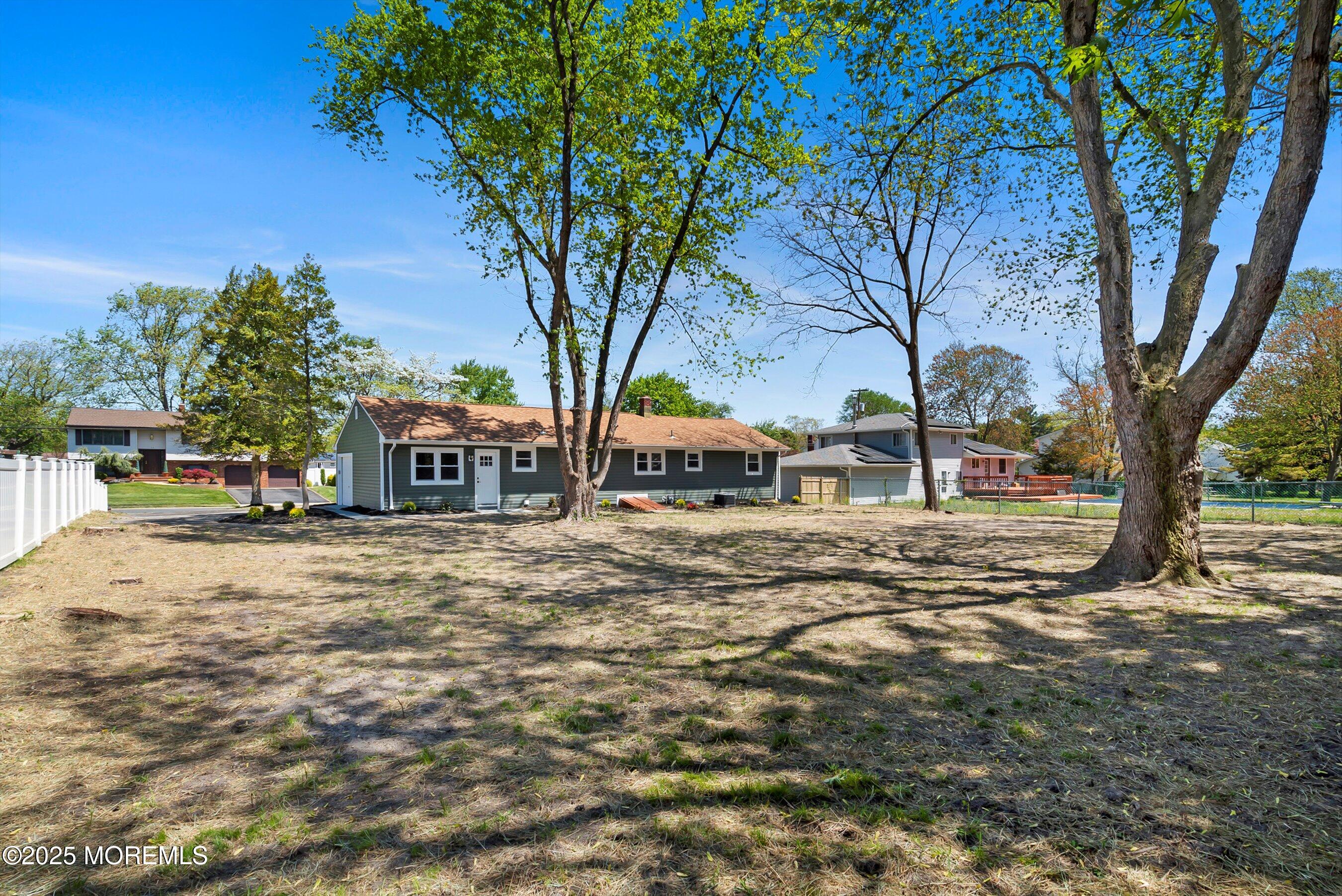 15 Springhill Drive Howell, NJ 07731 - Photo 31 of 32 a view of city street with tall trees