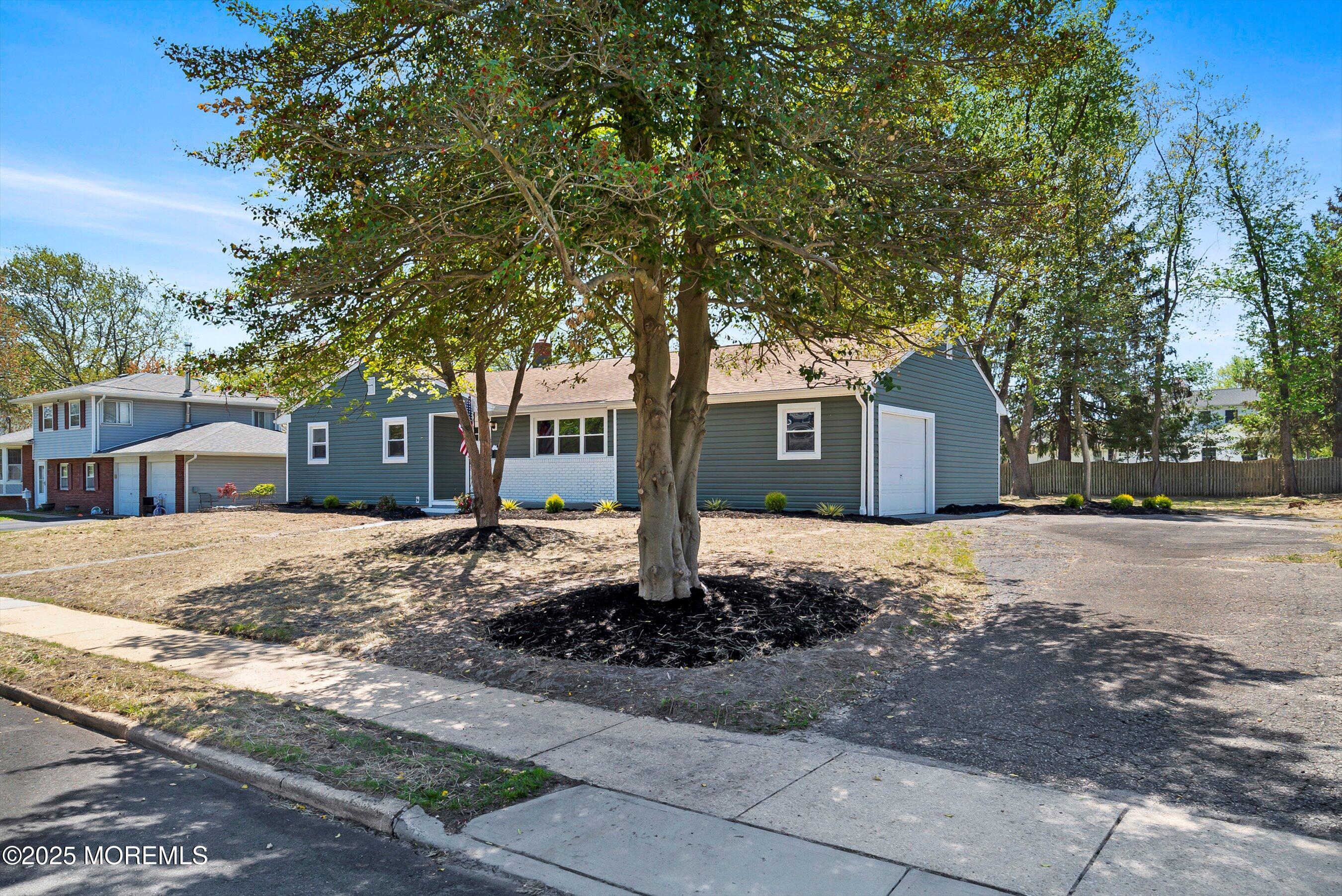 15 Springhill Drive Howell, NJ 07731 - Photo 4 of 32 a front view of a house with a tree