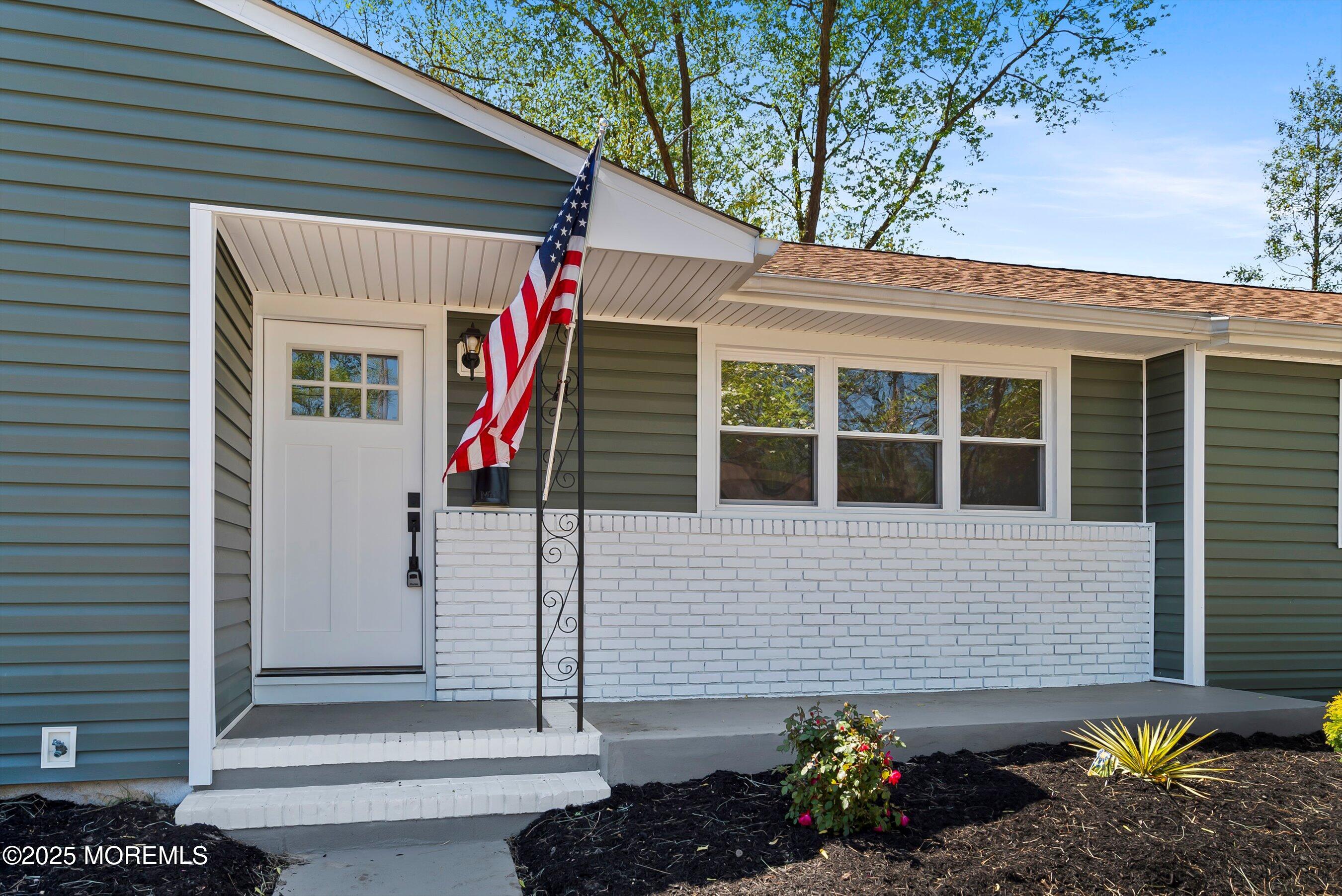 15 Springhill Drive Howell, NJ 07731 - Photo 5 of 32 a front view of a house with a garden