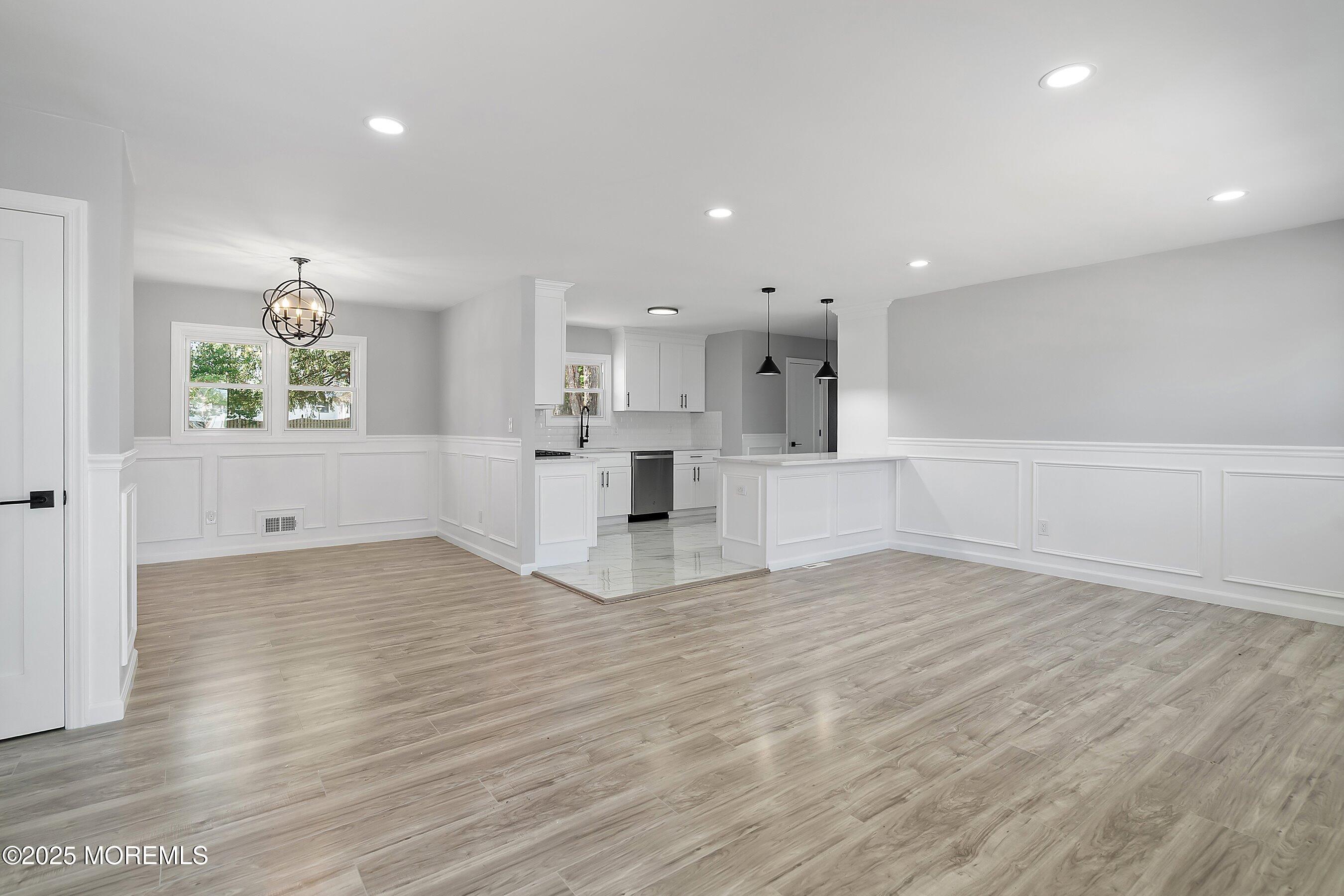 15 Springhill Drive Howell, NJ 07731 - Photo 6 of 32 a view of empty room with wooden floor and window