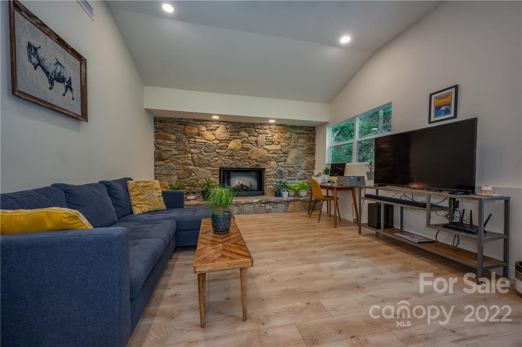 111 Jervey Road Tryon, NC 28782 - Photo 11 of 34 a living room with furniture and a flat screen tv
