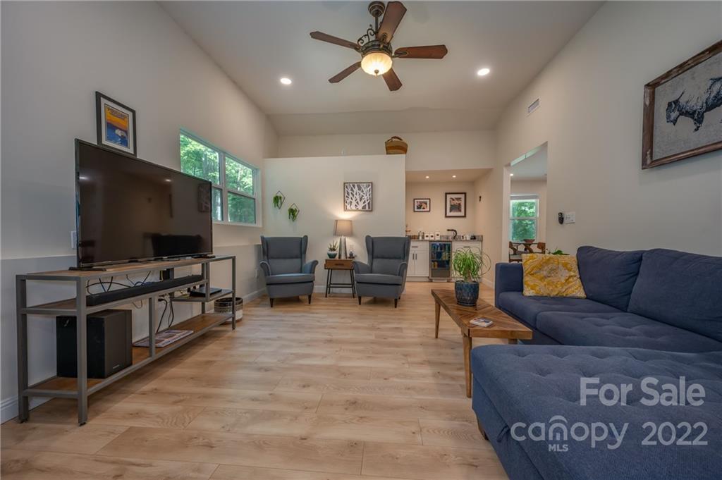 111 Jervey Road Tryon, NC 28782 - Photo 13 of 34 a living room with furniture and a flat screen tv