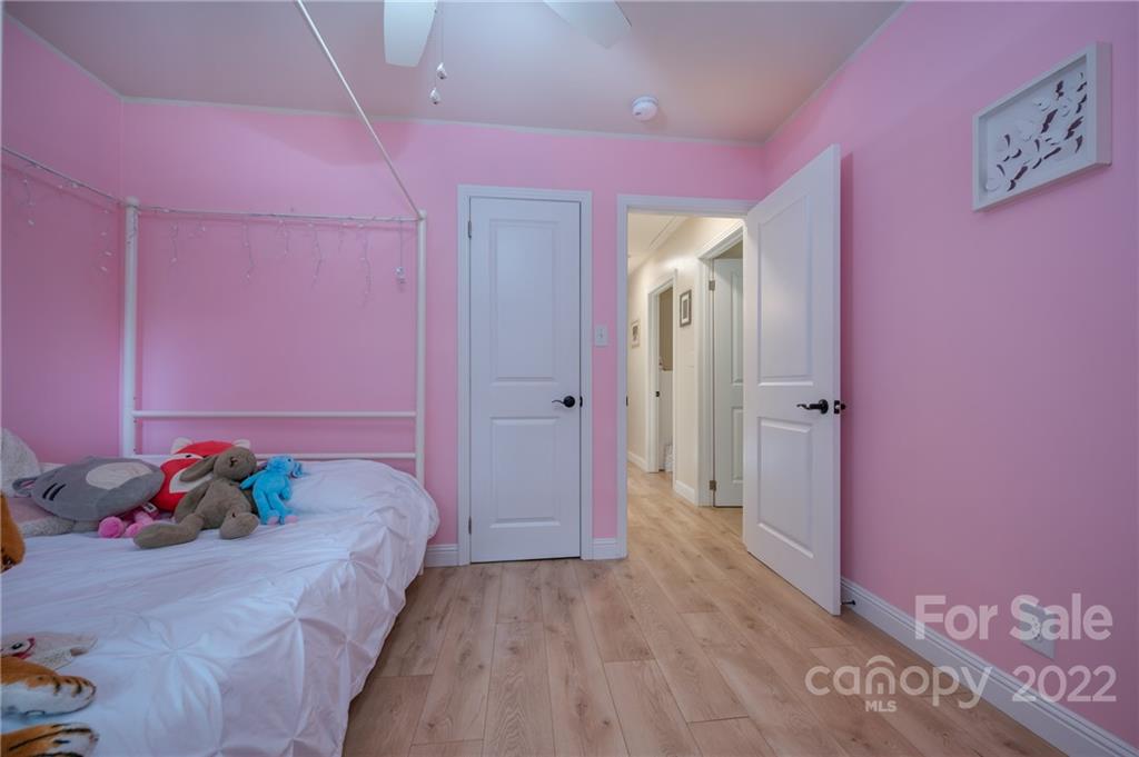 111 Jervey Road Tryon, NC 28782 - Photo 18 of 34 a bed room with a bed and a window