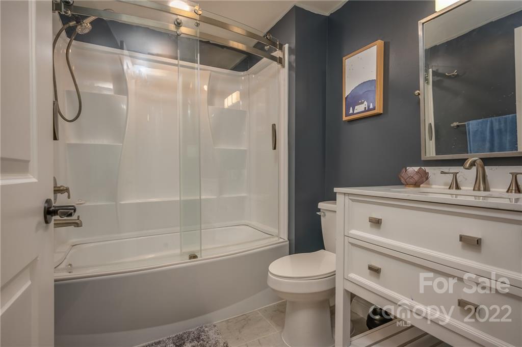 111 Jervey Road Tryon, NC 28782 - Photo 21 of 34 a bathroom with a shower a toilet and a sink